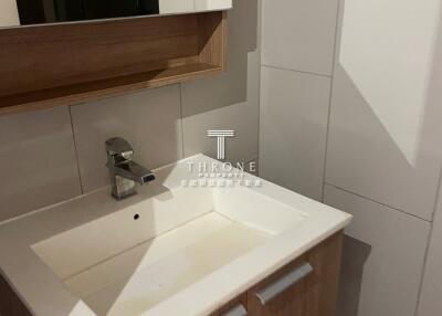 Modern bathroom sink with wooden cabinet