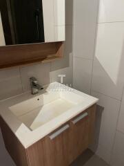 Modern bathroom sink with wooden cabinet