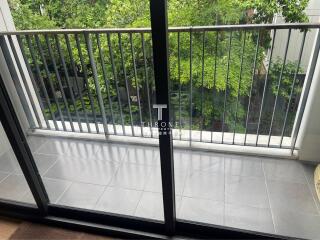 Balcony area with railing and tile flooring