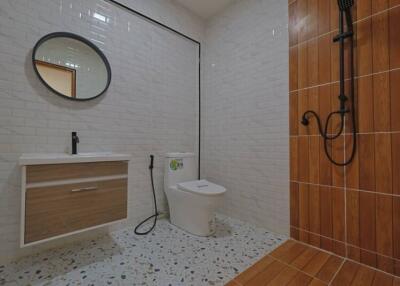 Modern bathroom with tiled walls and shower area