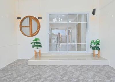 Bright living room with large window and decorative elements