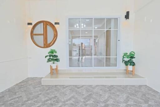 Bright living room with large window and decorative elements