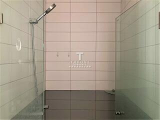 modern bathroom shower with glass panel