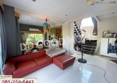 Spacious living room with red sectional sofa and modern decor