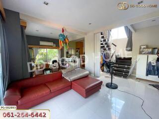 Spacious living room with red sectional sofa and modern decor