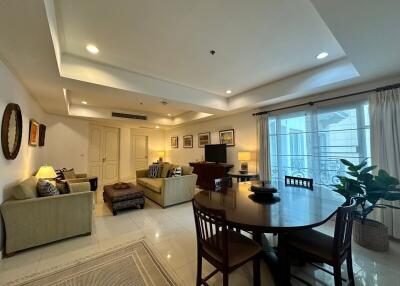 Spacious living room with contemporary furnishings and a dining area