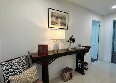 Decorated hallway with antique table and chair