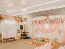 Decorated event space with pink drapery and chairs