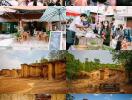 Photo of a busy outdoor market area with various stalls and people