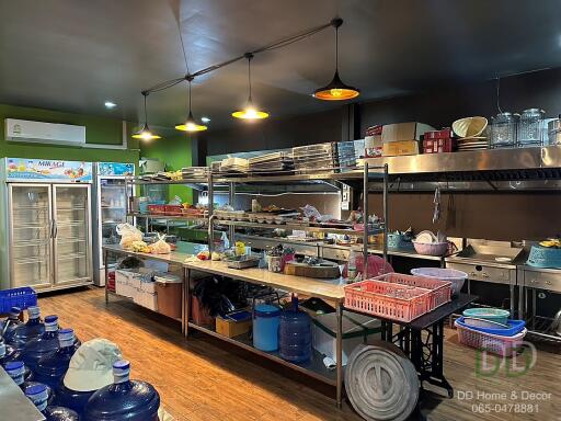 Spacious commercial kitchen with storage and appliances