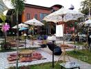 Outdoor seating area with parasols and cushions