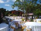 Outdoor event space with dining tables and chairs