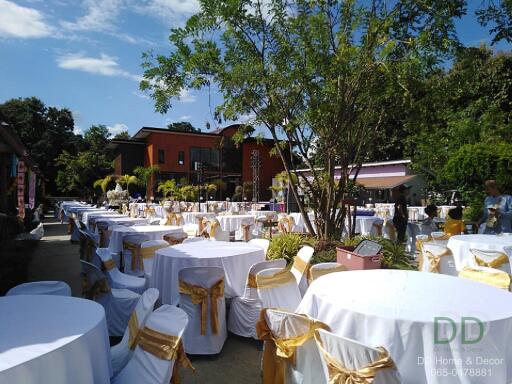 Outdoor event space with dining tables and chairs