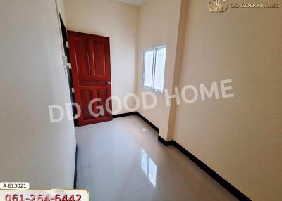 Empty room with red door and window