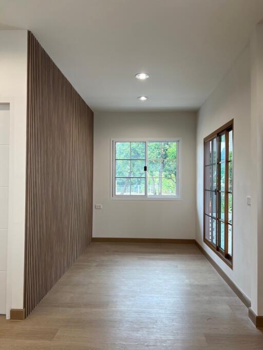 Well-lit interior space with wooden accents and large windows