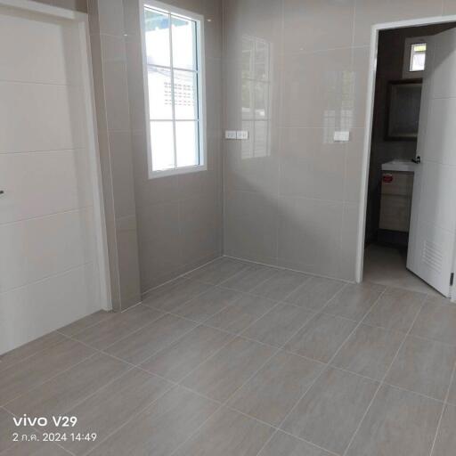 Empty bedroom with tiled floor