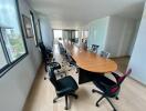 Modern conference room with a long table and multiple chairs