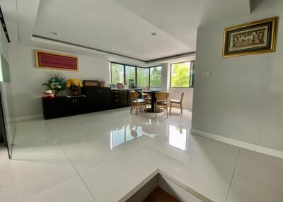 Spacious living room with dining area and large windows