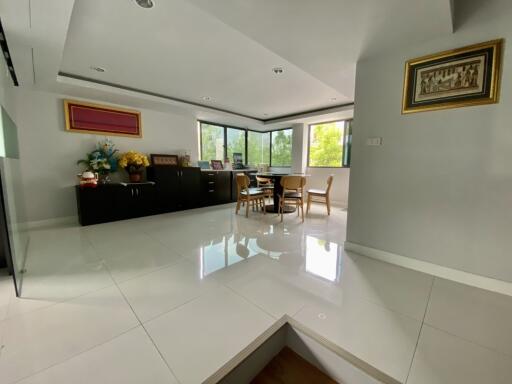 Spacious living room with dining area and large windows