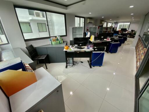 Modern office space with workstations and large windows