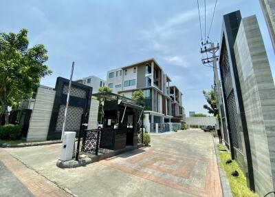 Modern apartment complex with gated entrance