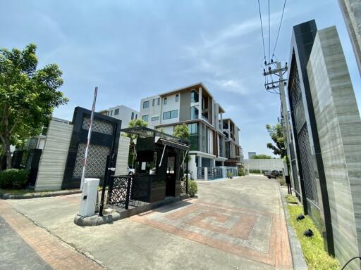 Modern apartment complex with gated entrance