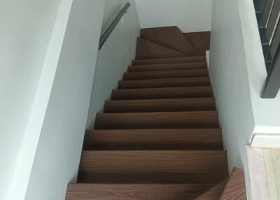 Wooden staircase with railings