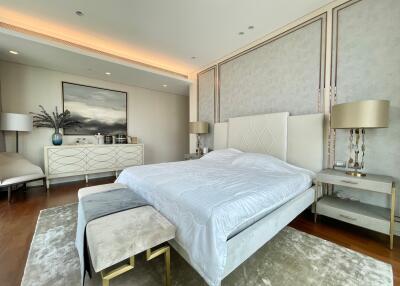 Luxurious modern bedroom with large bed, contemporary furniture, and soft lighting