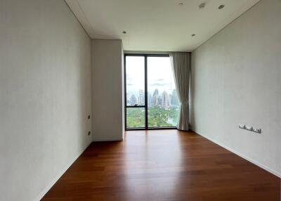 Spacious living room with large window and city view