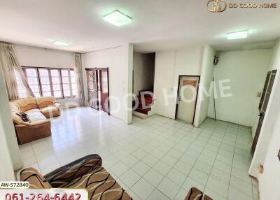 Spacious living room with tiled floors and ample seating