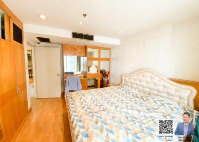 Spacious bedroom with large bed and ample storage