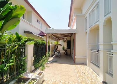 Exterior view of a building with a covered patio and garden