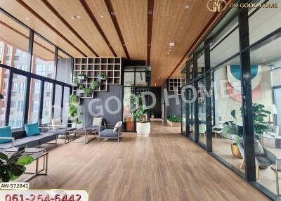 Spacious modern lobby with large windows and indoor plants