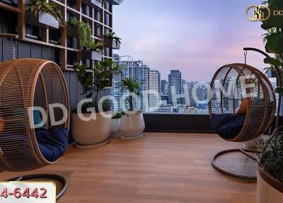 Living area with hanging chairs and city view