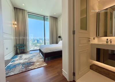 Modern bedroom with an en-suite bathroom and city view