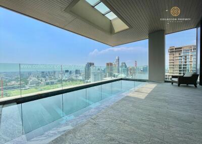 Spacious rooftop terrace with panoramic city view and pool