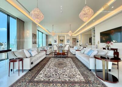 Spacious and luxurious living room with large windows and elegant decor