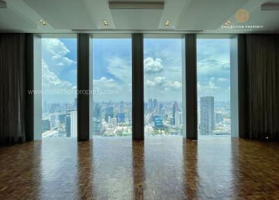 High-rise building with floor-to-ceiling windows overlooking cityscape