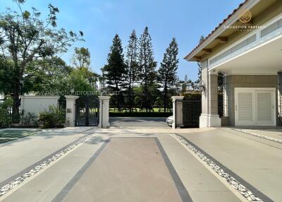 Exterior view of a property entrance with gate and driveway