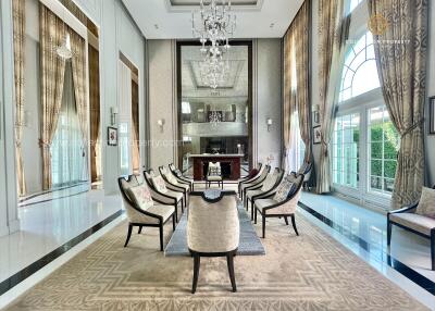 Elegant and spacious living room with high ceilings and chandeliers