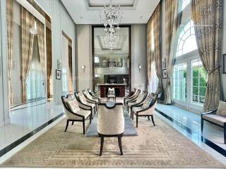 Elegant and spacious living room with high ceilings and chandeliers