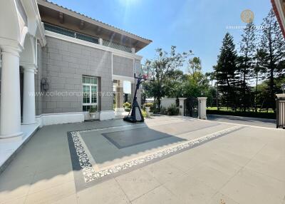 Spacious outdoor area with basketball hoop