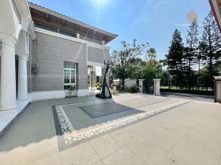 Spacious outdoor area with basketball hoop