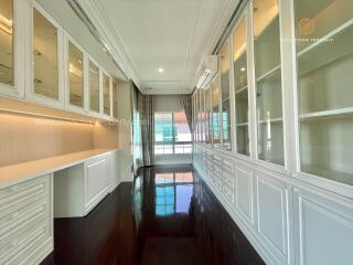 Spacious corridor with cabinets and large windows