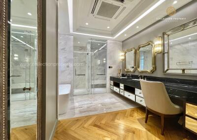 Luxury bathroom with dual sinks and marble accents