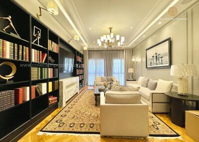 Elegant living room with modern furniture and bookshelf