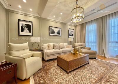 Elegant living room with neutral decor and large rug
