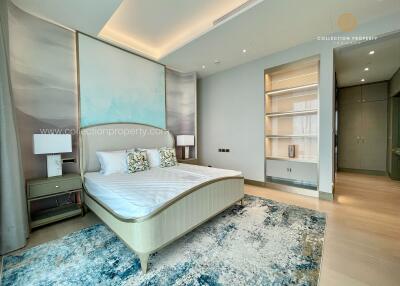 Modern bedroom with double bed and built-in shelving