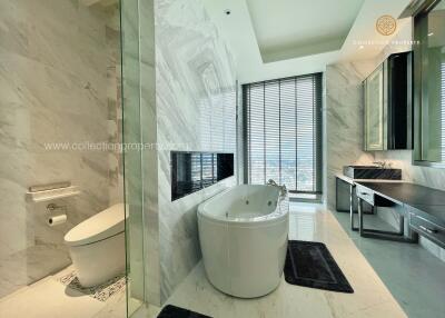 Luxurious modern bathroom with bathtub and large window