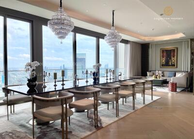 Luxury dining room with chandeliers and large windows